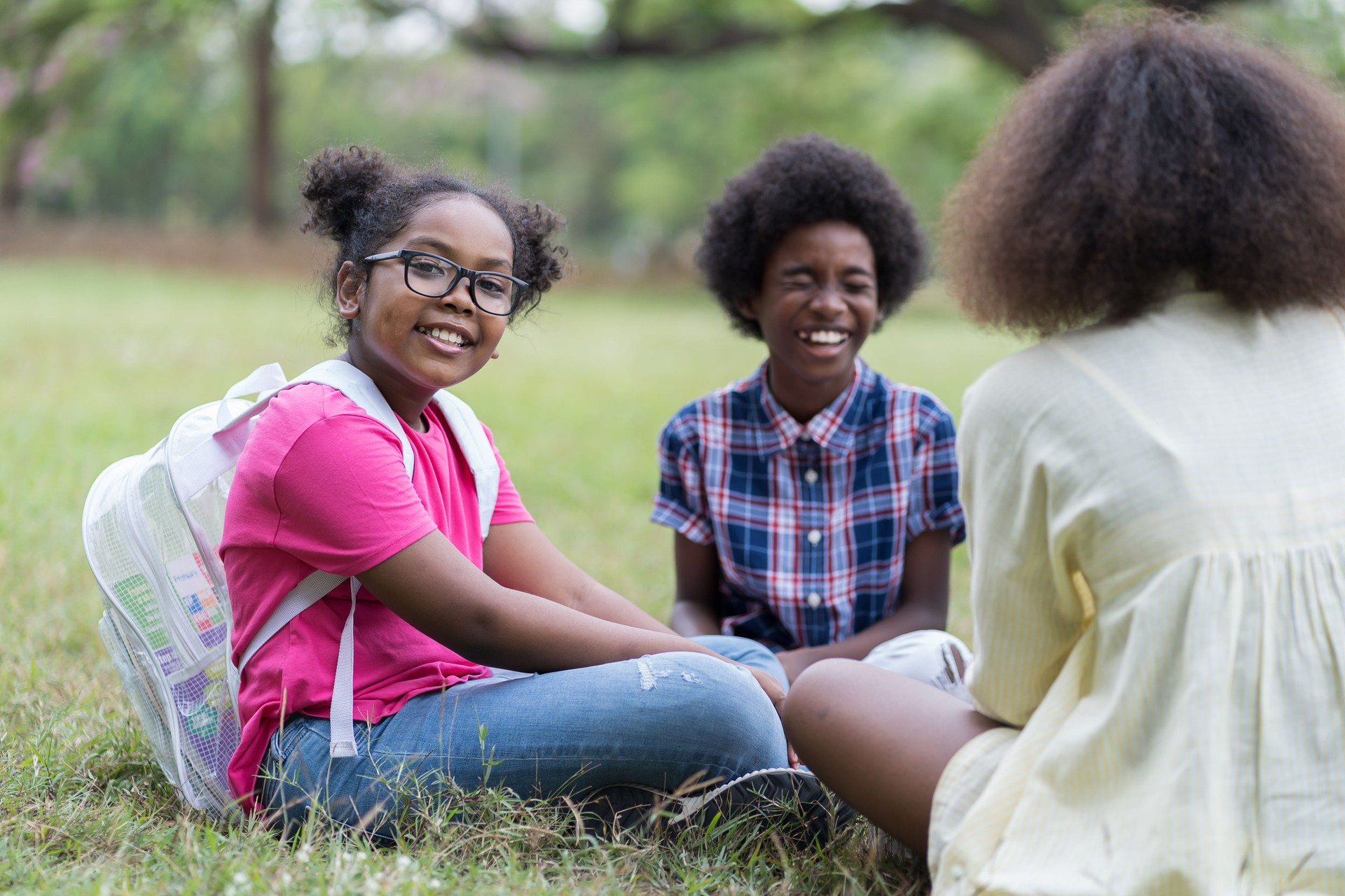 Group of African American children learning outdoor in the park. Diversity black people learning outside the classroom. Kids field trips outside. Kids and educational concept